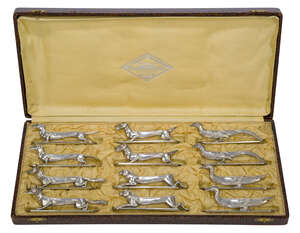 
	
		'Les Animaux Modernes' a set of twelve silvered-bronze knife rests  
		Second quarter...