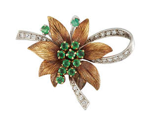 An emerald and diamond brooch, the central circular-cut emerald cluster with textured leaf surround and single-cut diamond ribbon decoration and emerald accent