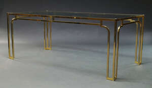 
	
		A brass plated dining table, c. 1970s, with rectangular glass top above, pierced...