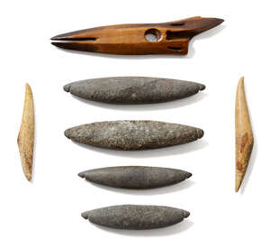 
	
		An inuit bone harpoon tip, late 19th century, four stone beads and two bone beads,...