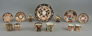 A Royal Crown Derby Imari pattern decorated globular miniature coal scuttle, 20th century, 8.5cm high, together with two  Royal Crown Derby coffee cans and sau