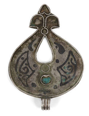 
	
		A Seljuq turquoise-set and nielloed silver pendant, Iran, 12th century, of drop form with...