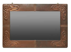 
	
		Archibald Knox (British 1864-1933), a copper wall mirror for Liberty & Co 
		c.1900,...
