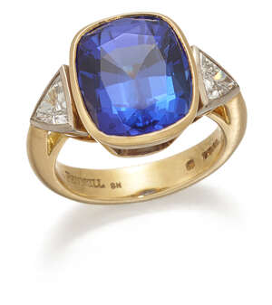 
	
		Theo Fennell a tanzanite and diamond ring, by Theo Fennell, collet set with an oval...