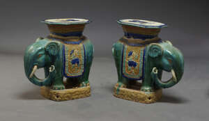 
	
		A pair of pottery elephant garden seats, 20th century, each moulded with a flat plateau,...