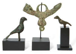 
	
		A Roman bronze phallic amulet, 1st-2nd Century A.D., and two Byzantine bronze birds, with...