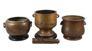 
	
		Three Japanese bronze jardinières, early 20th century, cast with a carp in waves,...