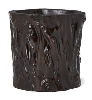 
	
		A Chinese zitan brush pot, late Qing dynasty, carved to the exterior as a gnarled tree...