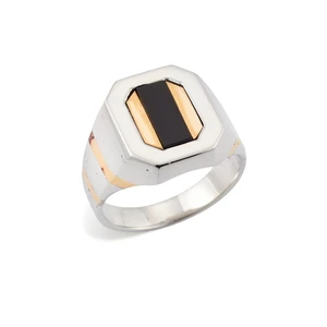 An 18ct gold onyx ring, composed of a rectangular onyx plaque, to a geometric two-colour gold...