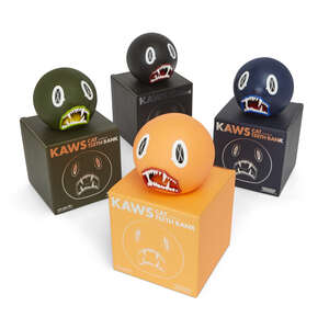 
	
		KAWS, 
		American b. 1974- 
		
		Cat Teeth Bank (Orange, Green, Blue, Black), 2007; 
		