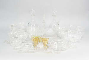 
	
		Two sets of four shot glasses, 20th century, decorated with gilt lining of grapes,...