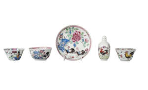A Chinese porcelain cup and saucer, 18th century, painted in famille rose enamels with two chickens amidst blossoming peony, diameter of saucer 11cm, the cup 4