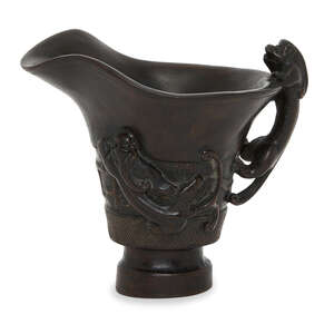 
	
		A Chinese zitan archaistic libation cup, 20th century, carved with chilong dragon form...