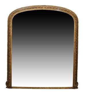 
	
		A large gilt overmantle mirror, late 19th century, of arched form with spiral motif and...