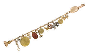 A late 19th / early 20th century gold charm bracelet, charms include: a pendant-mounted Egyptian gold 100 Piastres coin; a cornelian scarab pendant; a miniatur