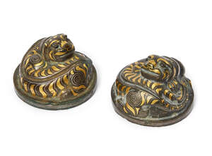 
	
		A rare pair of Chinese bronze and inlaid 'tiger' mat weights, Western Han dynasty, each...
