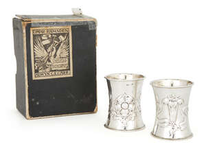 
	
		A pair of Edward VII napkin rings by Omar Ramsden & Alwyn Carr, London, 1908, one...