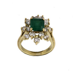 
	
		An emerald and diamond ring, cluster design, centring on a step-cut emerald framed by...