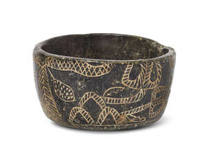 
	
		An black stone bowl with incised palm dates and flowers, possibly Bactrian, 3rd millenium...