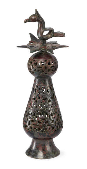 
	
		A Khorassan openwork bronze finial, Iran, 12th-13th century, on a spreading base, the...