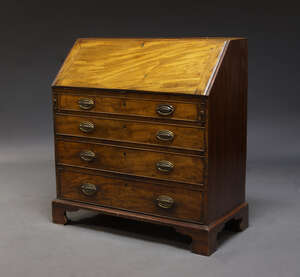 
	
		A mahogany bureau, 19th Century,  the fall enclosing an arrangement of pigeon holes and...
