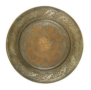 
	
		An engraved tinned copper dish, Deccan. 17th century, with owner's inscription "Ahmed...