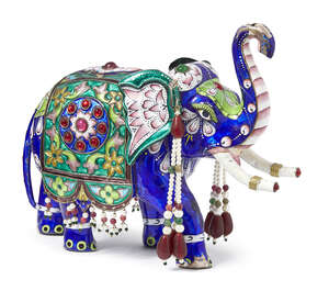 
	
		An enamelled silver elephant and peacock, India, 20th century, the elephant with stone...