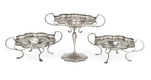 A set of three silver compotes, Birmingham, c.1921, G&C&Co, each designed with bifurcated twin handles to scalloped flowerhead dishes with pierced sides, the l