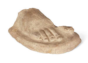 
	
		An Etruscan terracotta right foot, Circa 3rd-2nd Century B.C.
		Either votive or from...