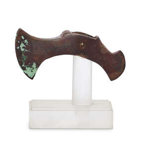 Two Bactrian copper axe heads, Central Asia, 2nd millennium B.C., the larger with rounded blade, the shaft with downward flaring 'tail', pierced by riv