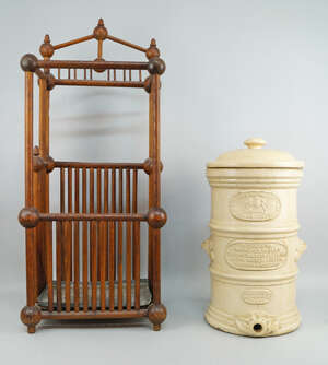 
	
		An oak turned umbrella stand, early 20th century, with a lead tray to the base, 83cm...