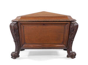 A Victorian mahogany sarcophagus wine cooler, third quarter 19th century, the hinged top...