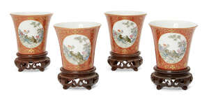 
	
		A set of four Chinese porcelain cups, Republic period, each decorated with two opposing...