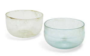 
	
		Two Roman glass hemispherical bowls, one cracked, Circa 4th Century A.D.
		Thin-walled...