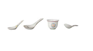Three Chinese porcelain spoons and a wine cup, late Qing dynasty, each painted in famille rose enamels, the cup 3.5cm high, the spoons 8.5cm - 11.5cm (4)