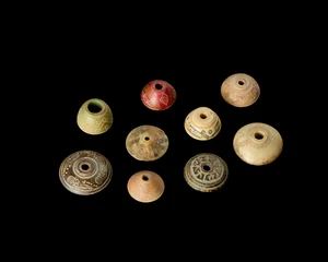 A group of bone spindles,Iran, circa 640-900AD
each of domed form with engraved abstract designs...