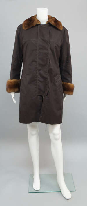 
	
		A mink lined brown nylon coat, together with a dyed fox fur lined parka jacket by Mr &...