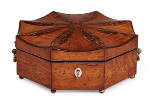 
	
		A George III satinwood octagonal box, of batwing shape, the shaped top with burr wood...
