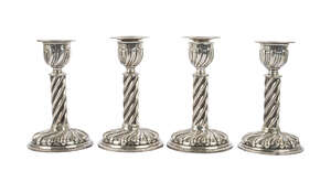 A matched set of four Victorian candlesticks, one pair London c.1891, Horace Woodward & Co, (Edgar Finley & Hugh Taylor) and another identical pair London c.19
