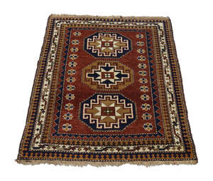 
	
		A Shirvan rug, mid to late 20th century, with three star centred octagons in a deep red...