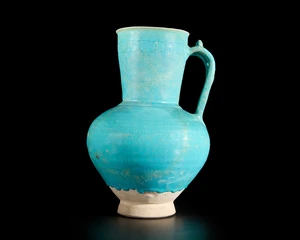 A globular turquoise blue glazed pottery jug, Ilkhanid central Iran, 12th/13th century, 
On...