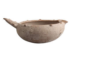 An Amlash handled pottery bowl, circa early 1st millenium BC, of deep form, with protrusions to rim and handle, everted spout, 28.9cm. wide    
		Provenance: 