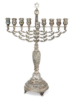 
	
		A large silver menorah by Joseph Zweig, London, c.1921, with foliate branches centred by...