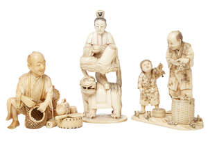 
	
		A Japanese ivory okimono group of a man putting grapes into a basket, late 19th/early...