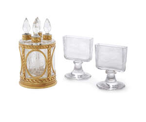 
	
		A French gilt metal cylindrical frame, in the Louis XVI taste, 20th century, with four...