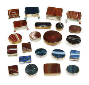 
	
		A group of twenty-two gilt and silvered metal-mounted agate boxes, early 20th century,...