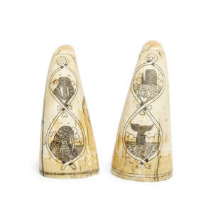 
	
		A scrimshaw walrus tusk cribbage board, late 19th century, engraved with a fish and...