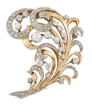 
	
		A diamond brooch, of scrolling feather design with old brilliant-cut diamond accents and...