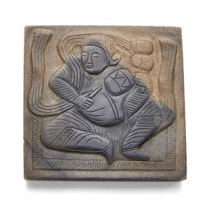 A rare Chinese hardstone musician belt plaque, Tang dynasty, the stone of grey tone with black inclusions, skillfully used to delineate a musician carved in lo