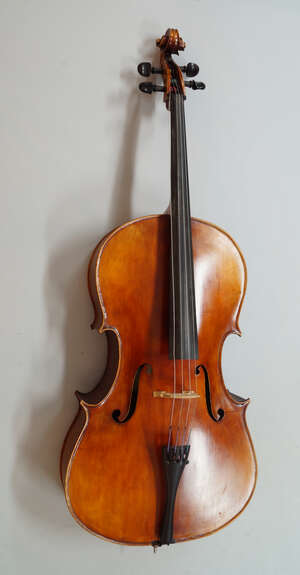 
	
		A cello made by the William Piper workshop, Hanbury, Worcestershire, bears labels to...